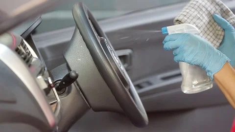 Cleansing car interior and spraying with disinfection liquid for protection 스톡 동영상 126690645