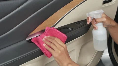 Cleansing car interior and spraying with disinfection liquid. Hands in rubber 스톡 동영상 197555285