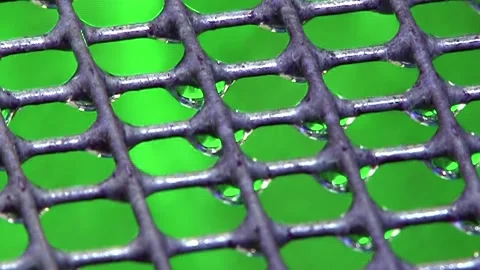 Cleansing Cascade on Hydro Filter Grid Against Emerald Green Stock Footage 337500911