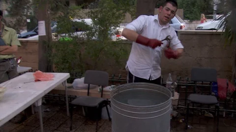 Cleansing Passover kitchen utensils with boiling water. Jerusalem. C0068-1 스톡 동영상 98542843