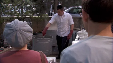 Cleansing Passover kitchen utensils with boiling water. Jerusalem. C0070-1 스톡 동영상 98543342