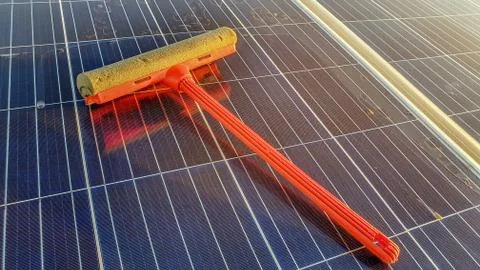 Cleansing Tool On Solar Panel Stock Photos