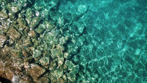 Clear Adriatic sea waters. Pristine ocean waters shimmer in the sunlight Stock Footage 264620495