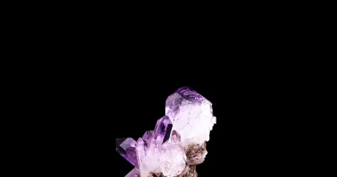 Clear amethyt crystal rotating 360° loop isolated on black background Video stock 253099626