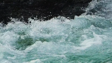 A clear and cold river flows in Austria Stock Footage 104671874