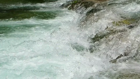 A clear and cold river flows in Austria Stock Footage 104672175