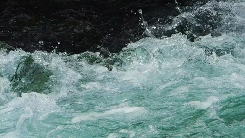 A clear and cold river flows in Austria Stock Footage 104672840