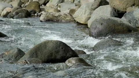 Clear and rocky mountain river scenery Stock Footage 320923009