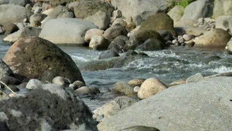 Clear and rocky mountain river scenery Video stock 320923093