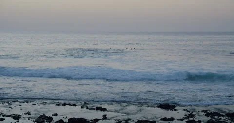 Clear azure Atlantic Ocean on background rocky volcanic shore, sunset. Perfect Stock Footage 196719721