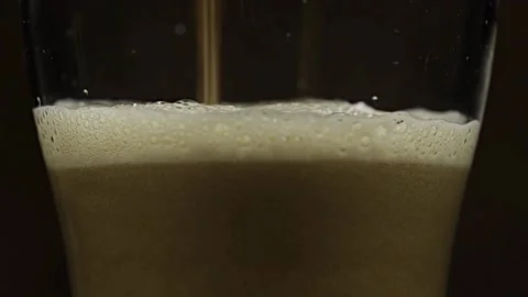Clear beverage and bubbles of carbon dioxide. fresh beer of double-hop just Stock Footage 265768168