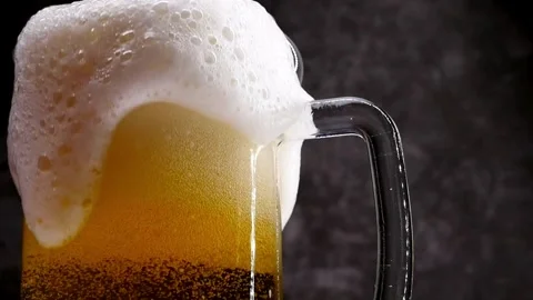 Clear beverage and bubbles of carbon dioxide. fresh beer of double-hop just Stock Footage 265769349