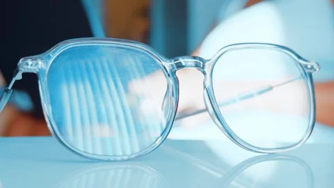 Clear Blue Light Blocking Glasses on Desk for Remote Work Vídeo Stock 333611529