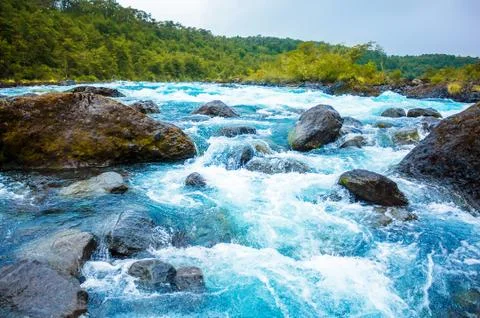 Clear blue mountain river Stock Photos