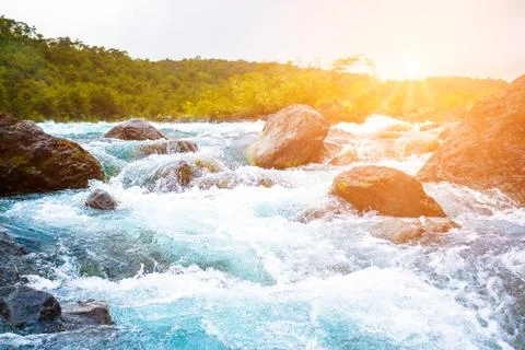 Clear blue mountain river Stock Photos