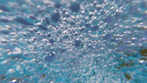 Clear blue pool water with continuous bubbles rising Stock Footage 340898872