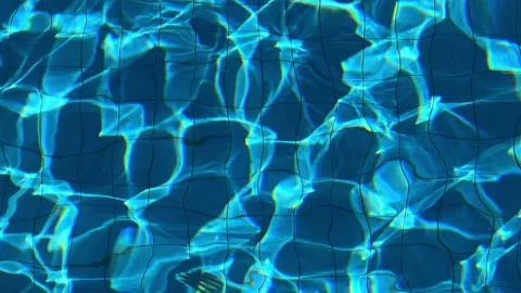 Clear blue ripple pool water with light reflection Stock Footage 224850867