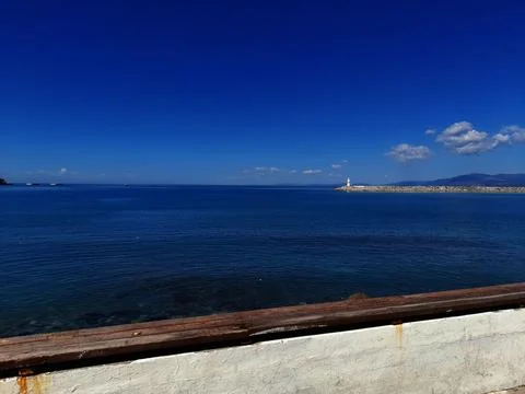 Clear Blue Sea View with Distant Lighthouse Stock Photos