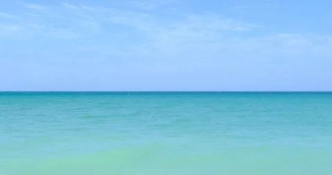 Clear blue sea with waves extending to the horizon on a sunny day Stock Footage 280342882