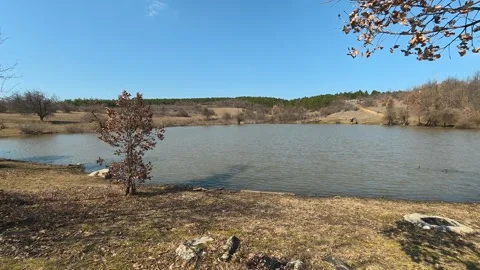 Clear blue sky above calm lake waters. Mount Rtanj Area, Serbia Видео 331294317