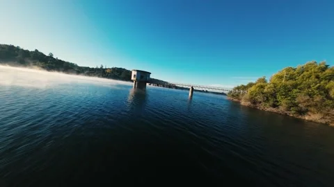 Clear blue sky above calm water surface at Castelo de Bode Stock Footage 342272497
