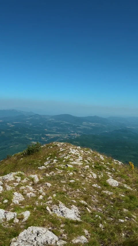Clear blue sky above rocky hilltop. Mount Rtanj, Serbia. Vertical Видео 342318355