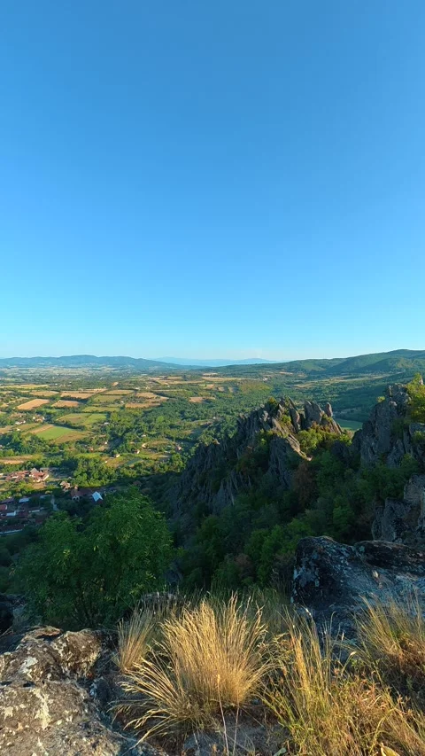 Clear blue sky above rocky hilltop. Boracki krs Serbia Vertical 動画素材 345005985