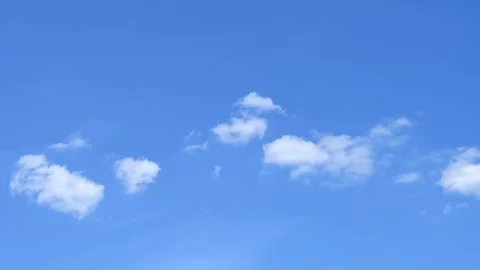 Clear blue sky and flowing white clouds as nature background Stock Footage 341861688