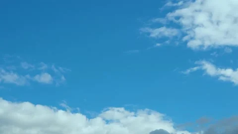 Clear Blue Sky and Some White Gray Cumulus Clouds in Sunny Weather Timelapse. Cl Stock Footage 220550832
