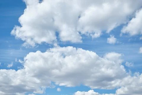 Clear blue sky and white clouds in summer during the daytime. Stock Photos