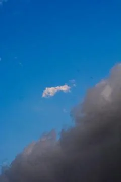 Clear Blue Sky Background With Scattered Clouds Stock Photos