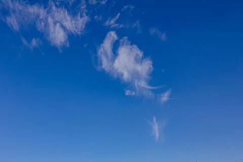 Clear blue sky background with a tiny cloud Stock Photos