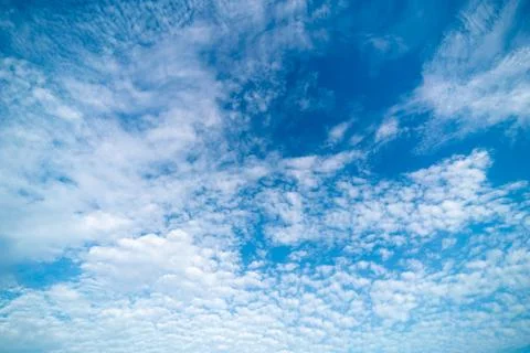 Clear blue sky with clouds background Stock Photos