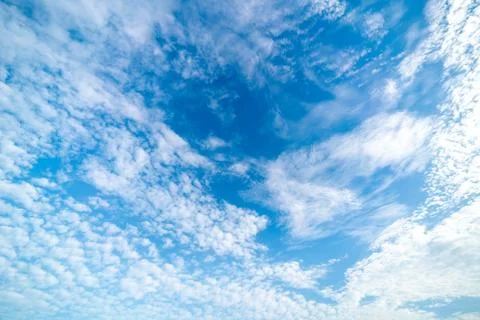 Clear blue sky with clouds background Stock Photos