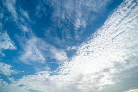 Clear blue sky with clouds background Stock Photos
