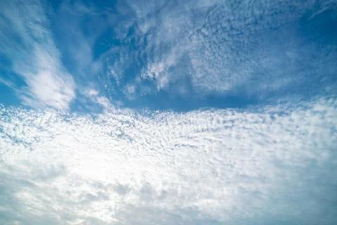 Clear blue sky with clouds background Stock Photos