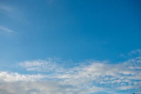 A Clear Blue Sky With Clouds on the Bottom of the Frame for Sky Replacement Stock Photos