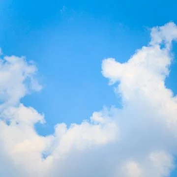 Clear blue sky with clouds Stock Photos