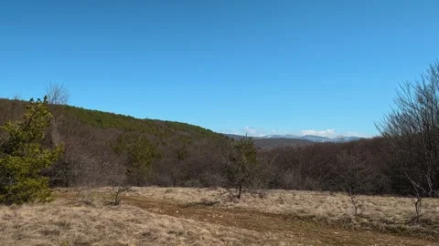 Clear blue sky dominates the horizon. Balkan, Eastern Europe, POV Vidéo 331780366