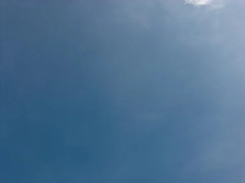 Clear blue sky with a few wispy clouds 스톡 사진