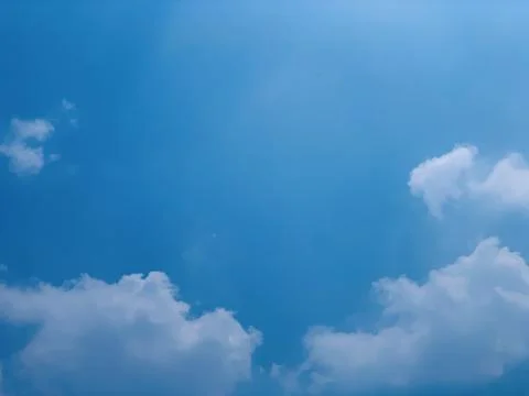 Clear Blue Sky with Fluffy White Clouds and Ample Copy Space Stock Photos