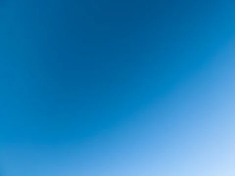 Clear blue sky gradient background, cloudless with copy space Фото