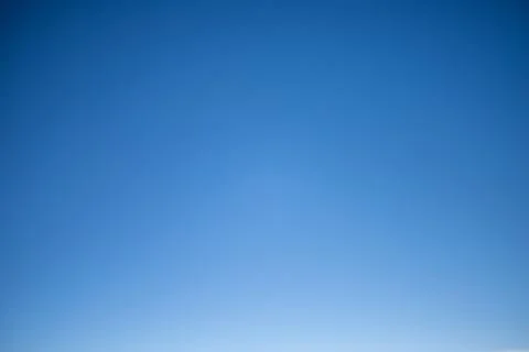 Clear blue sky gradients from deep to light blue Stock Photos