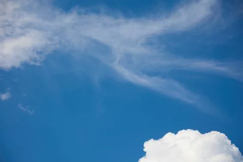 Clear, blue sky, with light clouds that are blown away by the wind Stock Photos