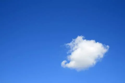 Clear blue sky with one cloud Stock Photos