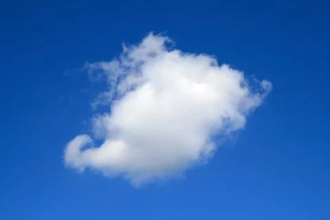 Clear blue sky with one cloud Stock Photos