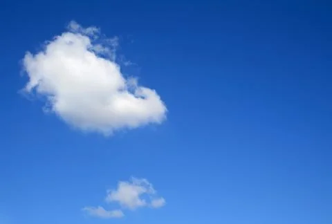 Clear blue sky with one cloud Stock Photos