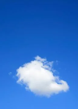 Clear blue sky with one cloud Stock Photos