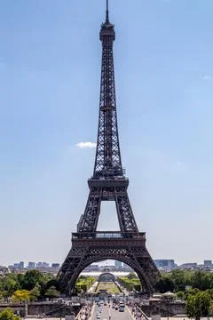 Clear blue sky over the Eiffel Tower in Paris, symbol of French culture and.. Stock Photos