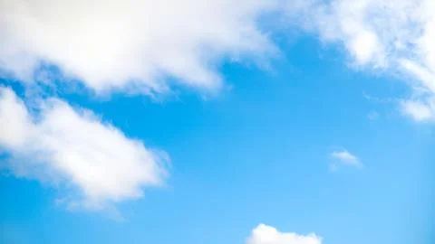 Clear blue sky with plain white cloud with space for text background. The vas 스톡 사진